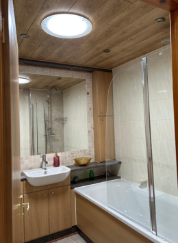 Can a Solatube daylight tunnel produce enough light for a windlowless bathroom in Livingston