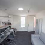 What is the importance of good lighting in the home workplace