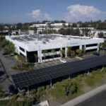 Solatube tubular daylighting domes grouped to maximise roof space for solar PV panels