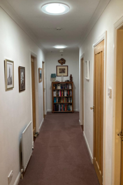 Will a Solatube 160DS be big enough for a dark hallway in Scotland